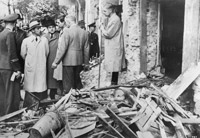 German Propaganda Minister Joseph Goebbels inspects a bomb damaged street in Berlin