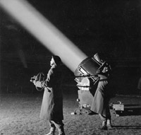 ATS officers operate a searchlight