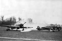 Smoke bombs envelop Hawker Hurricane Mark Is of 'B' Flight, No. 87 Squadron RAF